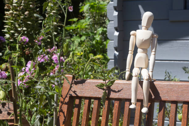 istock Mannequin for drawing sitting on a chair 1257271924