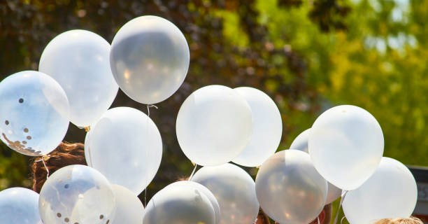 istock White balloons, outdoor at a celebration 1257273143