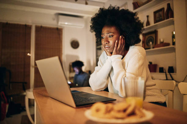 istock Young black woman studying on a laptop computer at home 1257273170