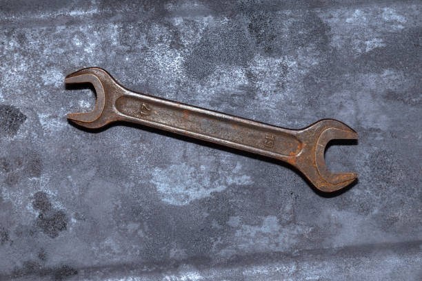 istock Rusty wrench on black metal 1257275755