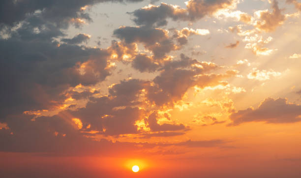 istock Beautiful colorful sunset sky with orange clouds. Nature sky background. 1257276206