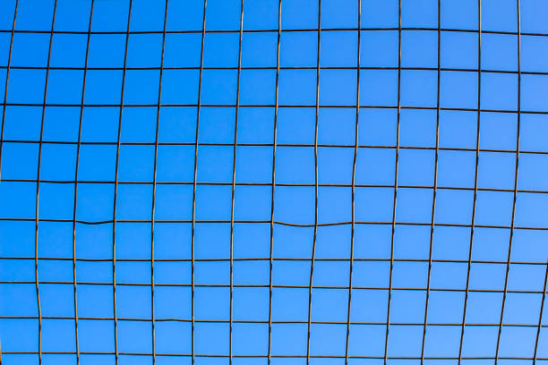 istock Mesh fence close up. 1257276891