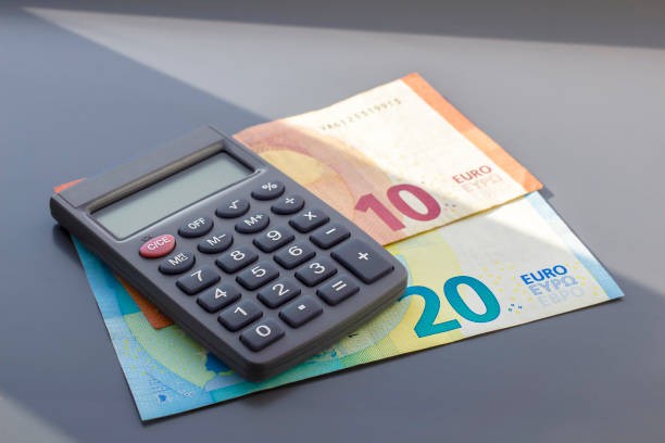 istock Euro bills and a calculator. 1257277181