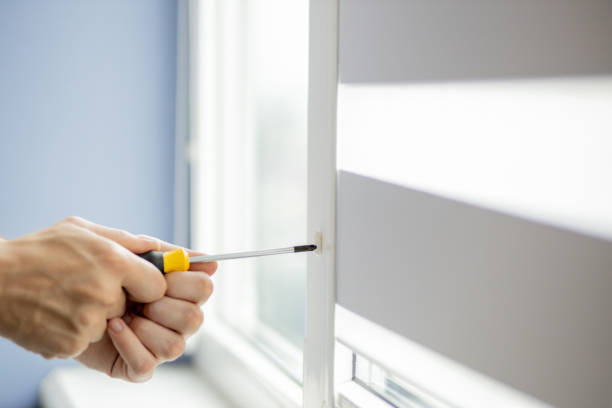 istock The man is repairing the plastic window 1257278349