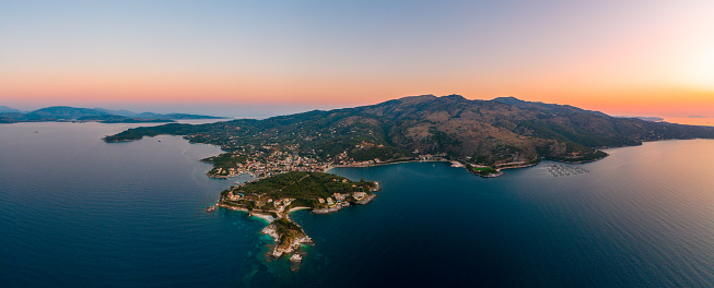 Corfu, Kerkyra, aerial panoramic photo of the town and port of Cassiopeia / Kassiopia at summer dusk