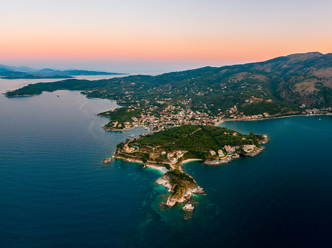 Corfu, Kerkyra, aerial panoramic photo of the town and port of Cassiopeia / Kassiopia at summer dusk