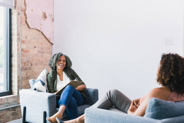 istock Female therapist and patient share light-hearted moment during session 1257279652