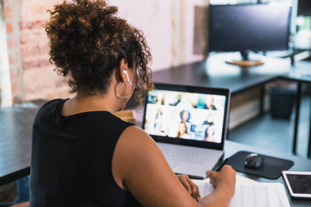 istock Businesswoman talks with colleagues during video conference 1257279680