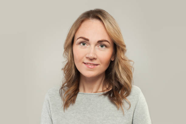 istock Cute woman on white background, portrait 1257280480