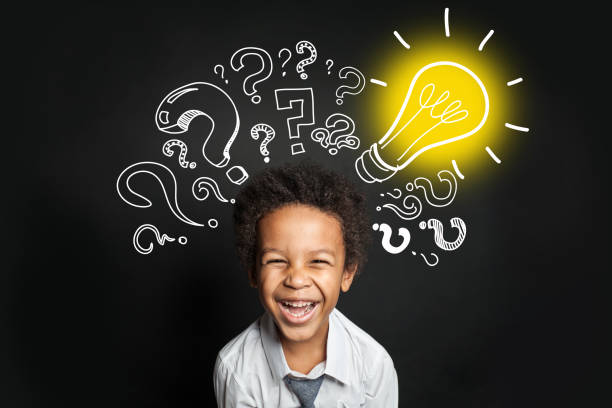 istock Lightbulb, question marks and smart laughing child. Brainstorming and idea concept 1257280872