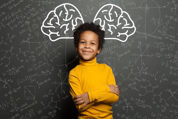 Smiling black child with big brain and science formulas on black, education and brainstorming concept Smiling black child with big brain and science formulas on black, education and brainstorming concept genius stock pictures, royalty-free photos & images