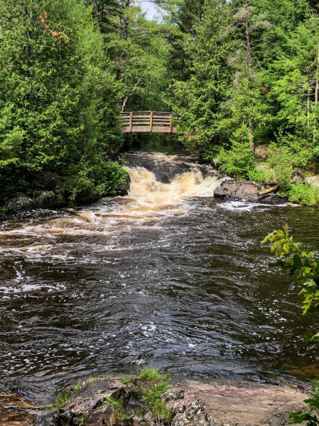 istock Waterfall under wooden bridge in Crivitz, Wisconsin 1257285180