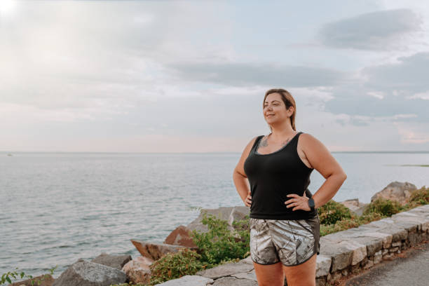istock Woman exercising outdoors 1257285577