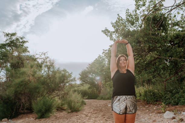 istock Woman stretching before exercising outdoors 1257285601