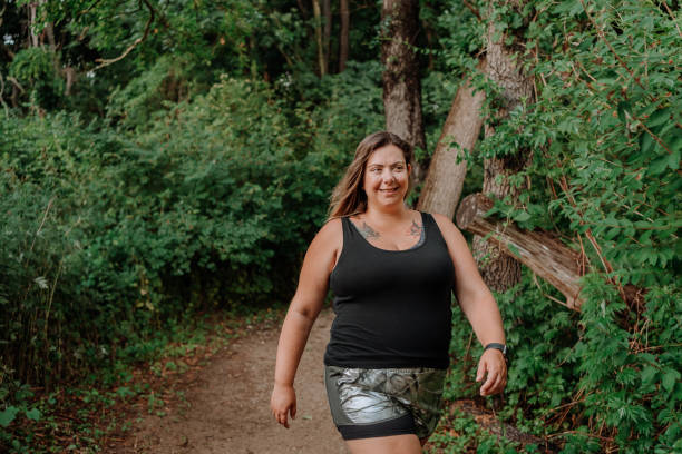 istock Woman hiking in a trail 1257285676