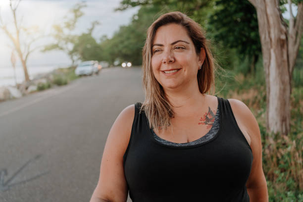 istock Woman walking outdoors with positive attitude 1257285766
