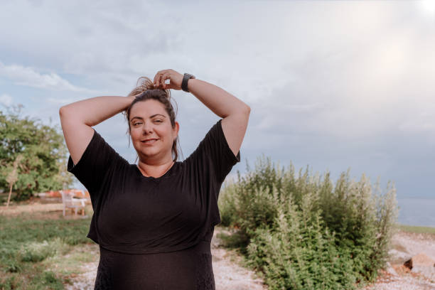 istock Woman walking outdoors with positive attitude 1257285777