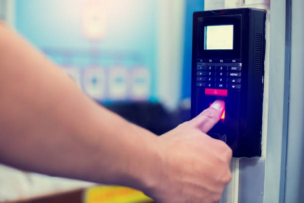 istock Staff push down electronic control machine with finger scan to access the door of control room or data center. 1257293231