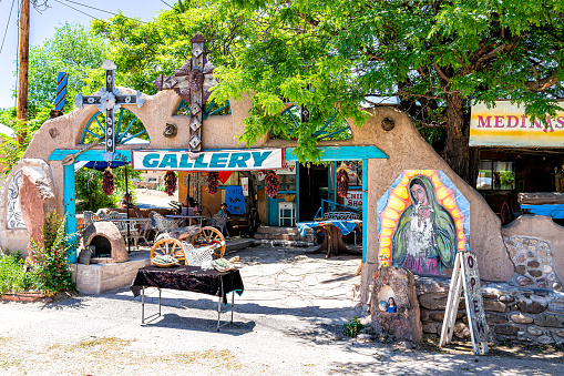 Chimayo, USA - June 19, 2019: Shop Art Gallery souvenir store in small town New Mexico city village with adobe style architecture on high road to Taos
