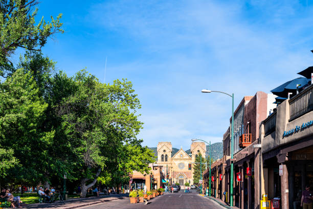 old town street road by plaza in united states new mexico city with adobe style architecture church - taos imagens e fotografias de stock