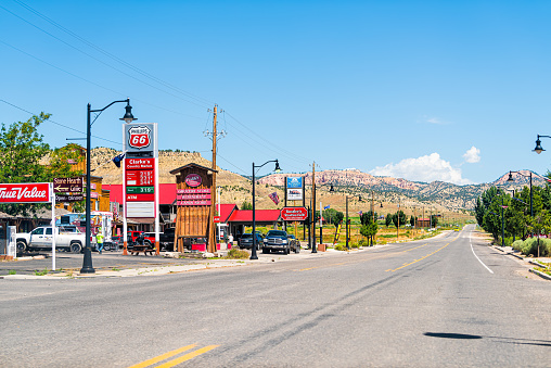 Tropic, USA - August 1, 2019: Small town with sign for gas station and Clark's Country Market in Grand Staircase-Escalante National Monument near Bryce