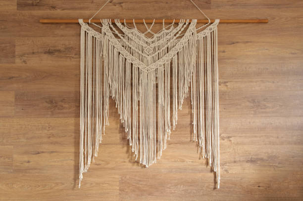 istock Macrame wall panel. A minimal, stylish, trendy concept with a beautiful background with light neutral colors. 1257295884
