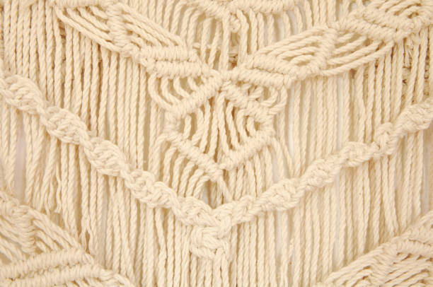 istock Macrame pattern. A minimal, stylish, trendy concept with a beautiful background with light neutral colors. 1257296010