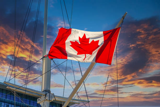 istock Canadian Flag on Ship in Sunset 1257299733