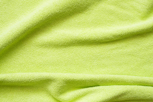istock Green towel fabric texture surface close up background 1257299873