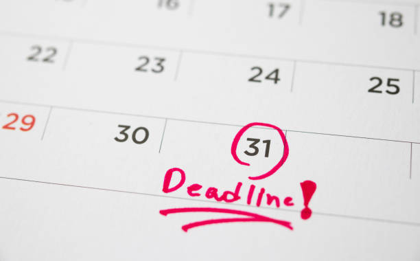 istock Deadline write on white calendar page date close up 1257299983