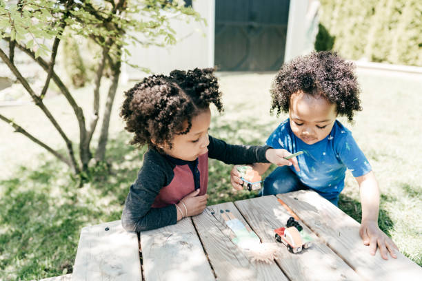istock Two little kids  playing outdoor 1257300055