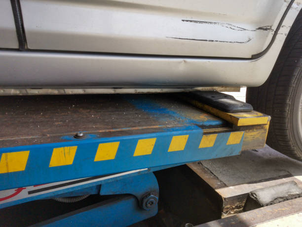 istock Car on garage hydraulic jack 1257301463