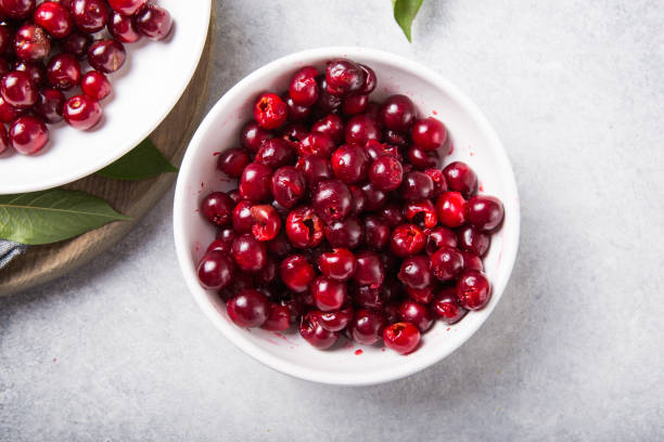 Fresh Pitted Cherries Fresh Pitted Cherries pitter stock pictures, royalty-free photos & images