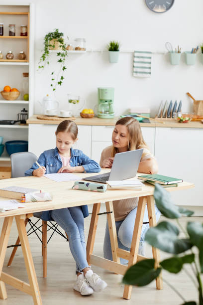 istock Girl Doing Homework with Mom 1257306819