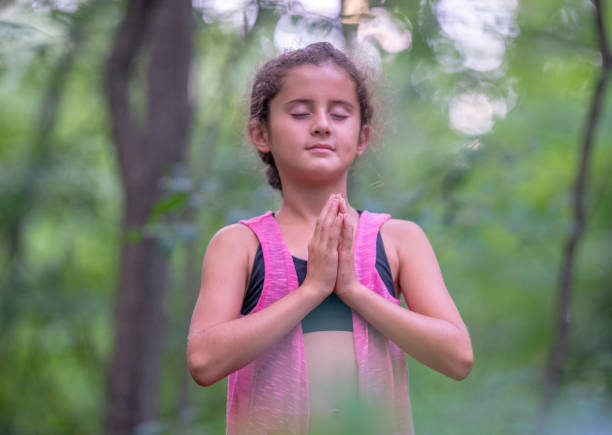 istock Young girl yoga 1257308890
