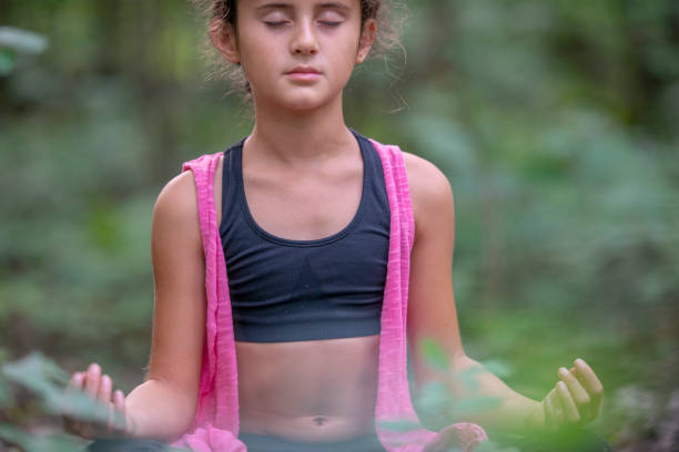 istock Young girl yoga 1257308896