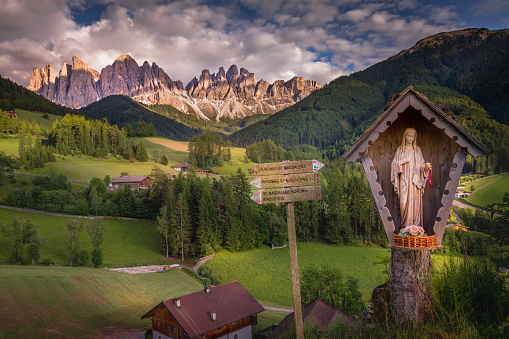 Idyllic St Magdalena landscape with virgin Mary chapel at sunset, Dolomites alps – Italy