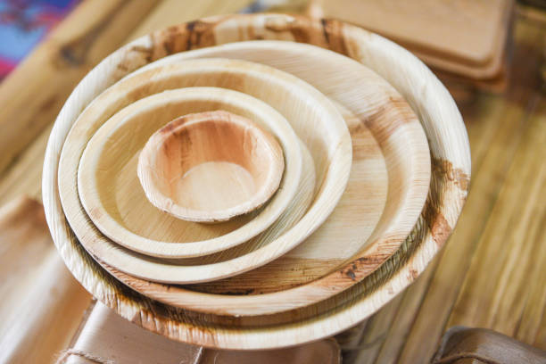 istock Natural eco-friendly food packaging disposable utensils with dish plate - Eco friendly disposable tableware from palm leaf or betel nut , zero waste environment concept 1257315103