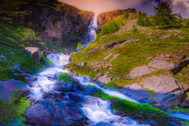 Ethereal falls – cascade landscape, long exposure – Gran Paradiso Alps – Italy