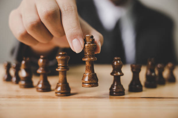 istock Businessman with chess board game. Plan strategy and tactic concept 1257324016