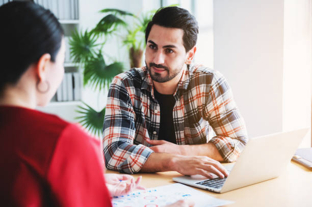 istock Coworking process, Corporate employees team working brainstorm project document sheet paperwork. Business startup company teamwork on meeting in modern office 1257324037