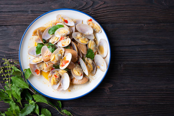 istock Stir fried Spicy Clam (Surf clam, Short necked clam, Carpet clam, Venus shell, Baby clam) with Thai Holy Basil 1257327516