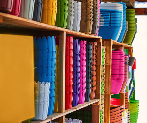 istock Texture background of multi-colored flower pots standing on the shelves 1257331717