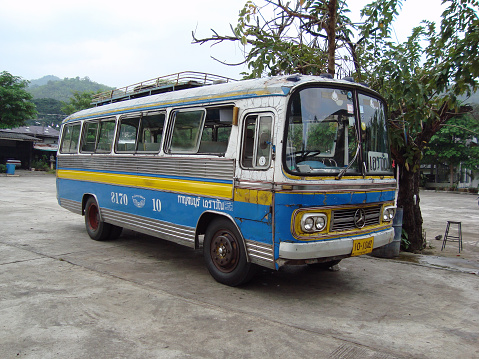 Kanchanaburi, Thailand - November 19th, 2008: an old bus parked at a station in the town of Kanchanaburi.