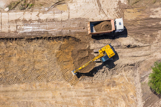 istock industrial machinery doing earth works. aerial top view 1257332791