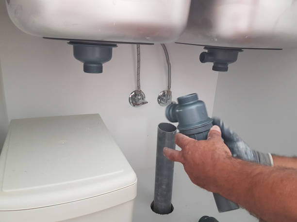 istock plumber pipette sink woriking on adjustment 1257334450