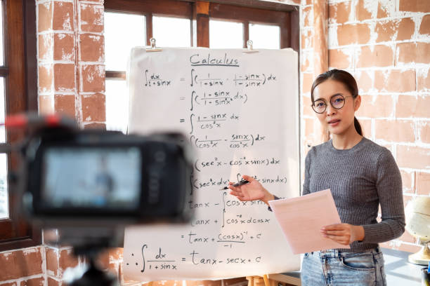 Asian woman teacher teaching lesson online learning via internet at home, self study and e-learning new normal concept Asian woman teacher teaching lesson online learning via internet at home, self study and e-learning new normal concept zoom classroom stock pictures, royalty-free photos & images