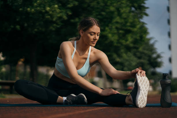 istock Woman is warming up for jogging 1257337736