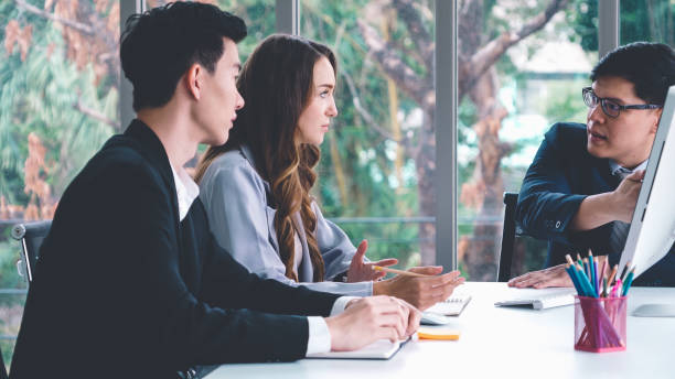 istock Angry business person dispute work problem in group meeting 1257337808