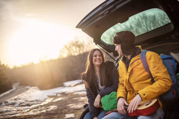 istock Yong couple with guitar in car trunk 1257337849